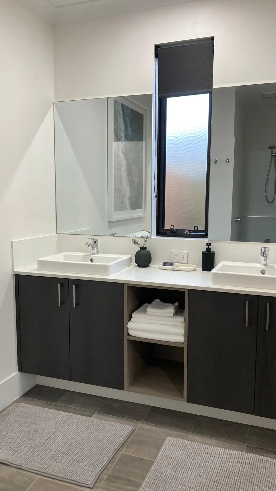 Bathroom with double vanity and fresh towels